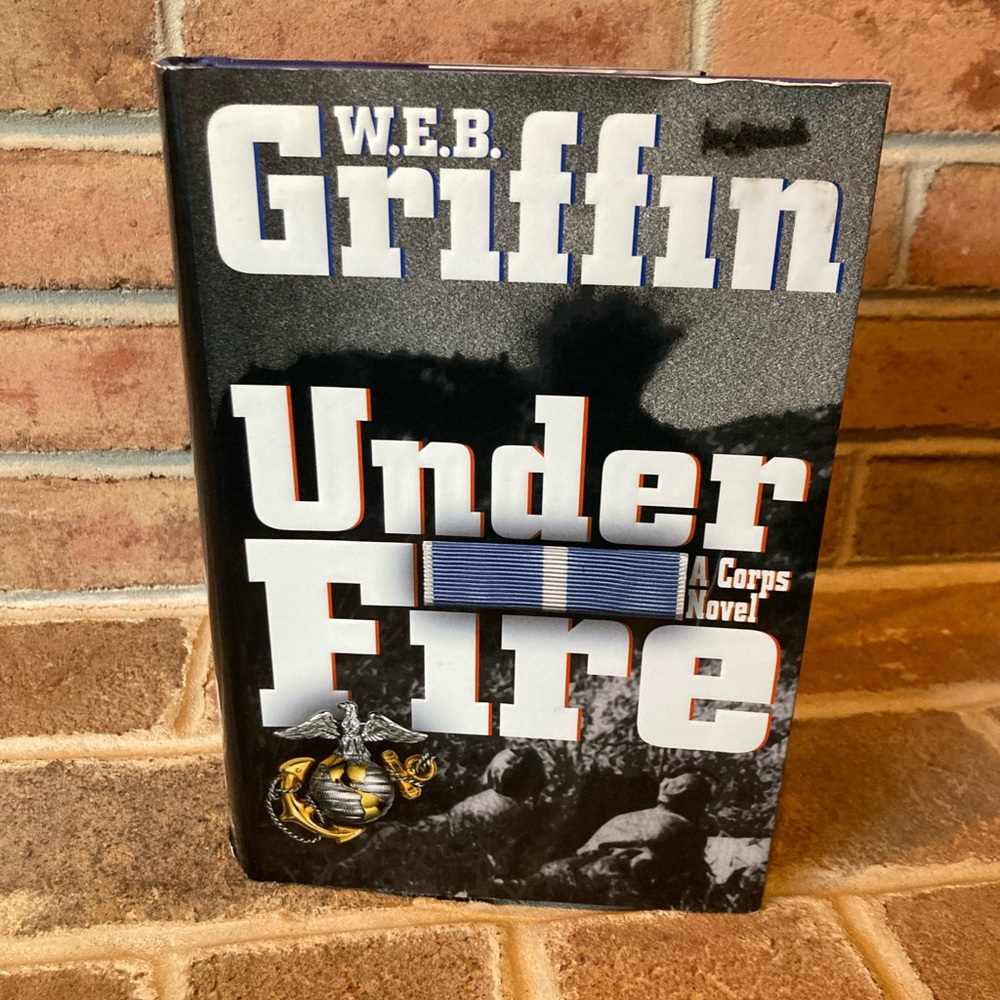 “Under Fire: A Corps Novel” - W.E.B. Griffin 
Hard cover